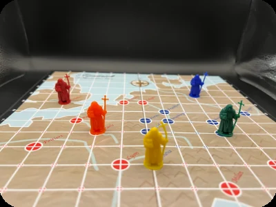 Coloured pawns of the Bishop’s Agents standing on the Tyndale game board.